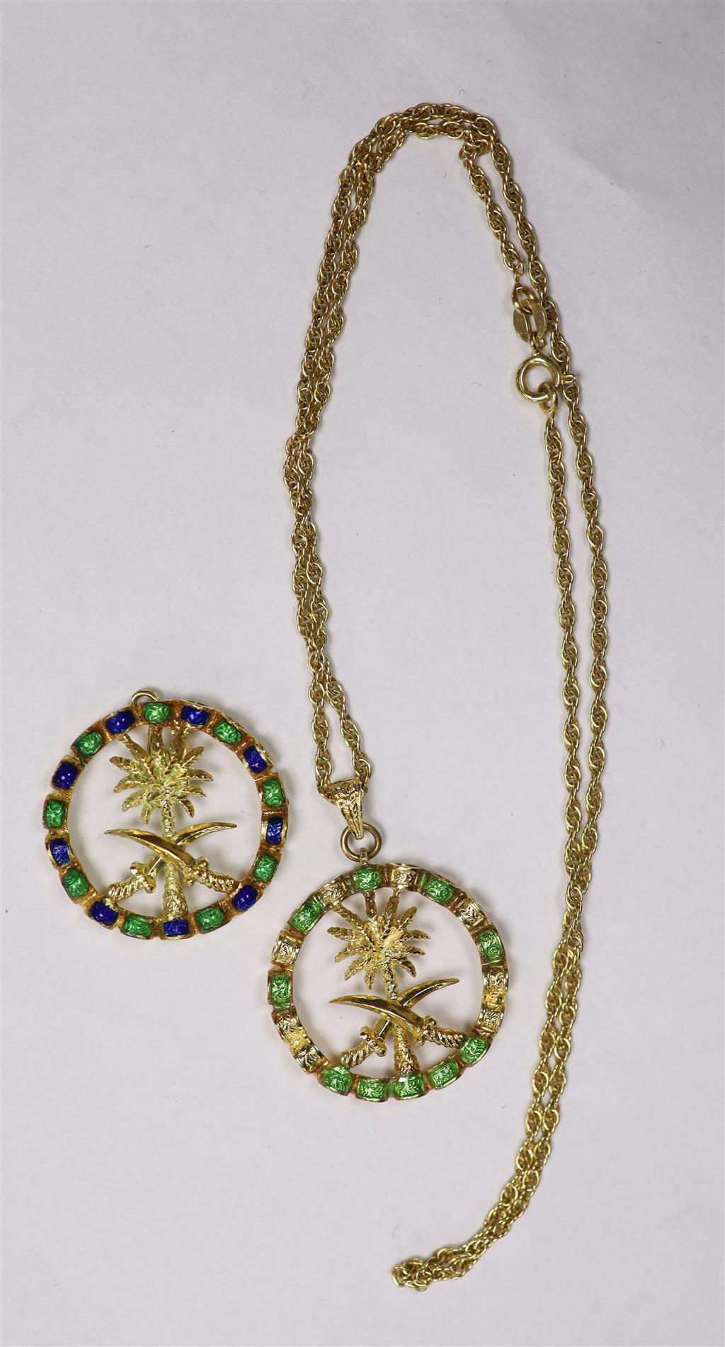 Two modern Italian 750 yellow metal and enamel Emblem of Saudi Arabia circular pendants, one with 750 chain.